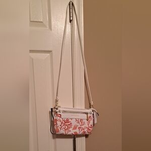 Liz Claiborne crossbody purse NWT comes with a small charm.